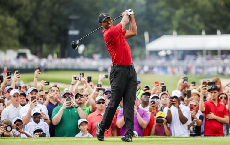Tiger Woods returns to win a title in the Tour Championship, more than five years later